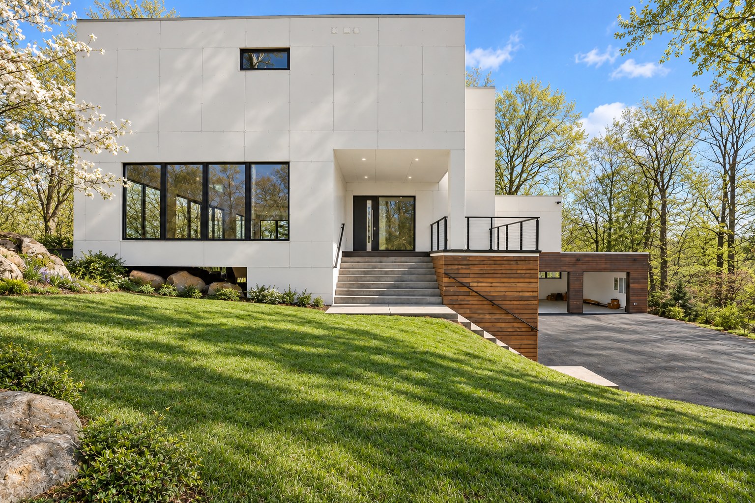 Carey Drive, Bedford, NY: white modern residence with cedar-clad garage on a wooded lot